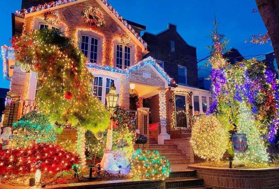 Colorful Christmas decorations and illuminated trees outside a Brooklyn house